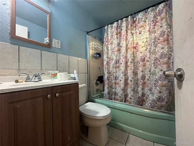 260 Sheridan Blvd, Denver, CO 80226 - full bath with tile patterned flooring, shower / bathtub combination with curtain, vanity, tile walls, and toilet
