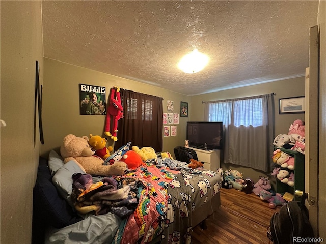 260 Sheridan Blvd, Denver, CO 80226 - bedroom featuring a textured ceiling and wood finished floors