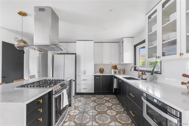 3103 W Bellewood Dr, Englewood, CO 80110 - kitchen with stainless steel range with gas stovetop, dark cabinetry, a sink, island range hood, and white cabinets