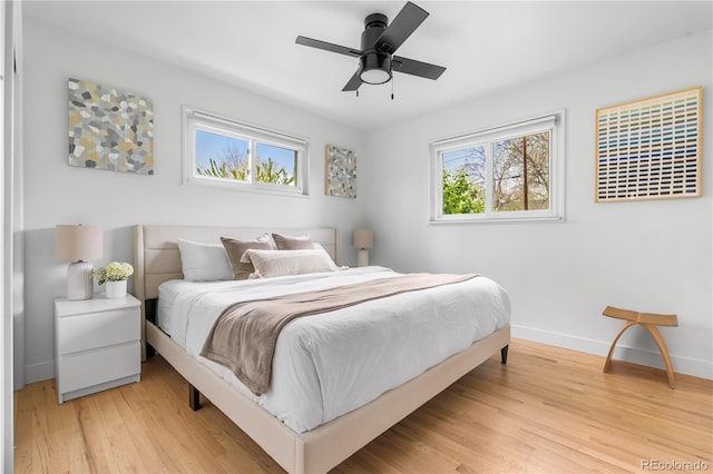 3103 W Bellewood Dr, Englewood, CO 80110 - bedroom with baseboards, light wood-style floors, and ceiling fan