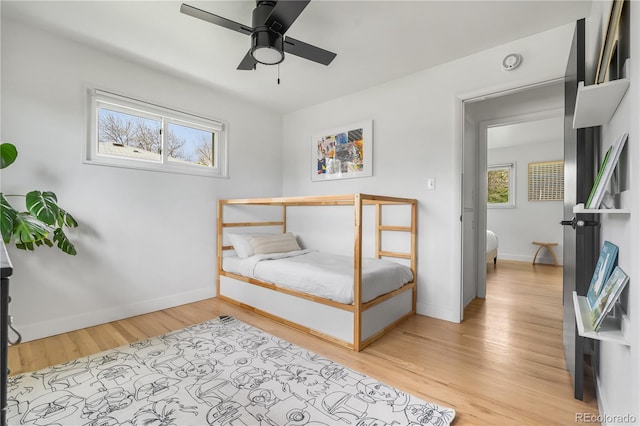 3103 W Bellewood Dr, Englewood, CO 80110 - bedroom with light wood-style floors, baseboards, and a ceiling fan