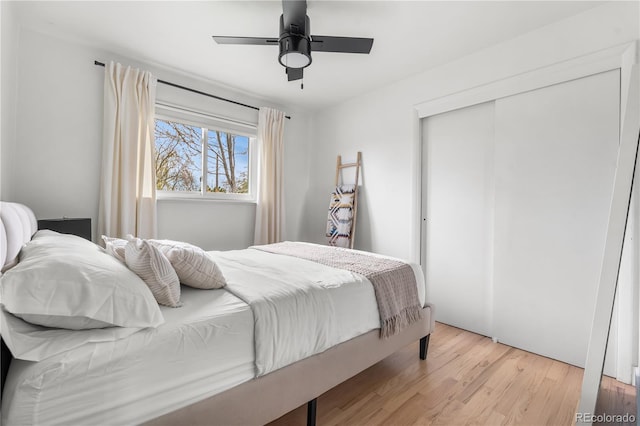 3103 W Bellewood Dr, Englewood, CO 80110 - bedroom with light wood-style floors, a closet, and a ceiling fan