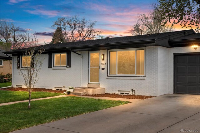 3103 W Bellewood Dr, Englewood, CO 80110 - single story home featuring brick siding, an attached garage, driveway, a front lawn, and roof with shingles