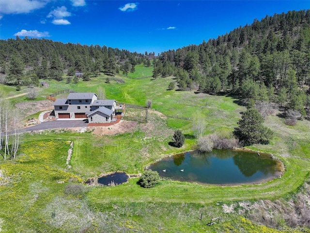 20101 Spring Gulch Rd, Morrison, CO 80465 - aerial view of property and surrounding area with a heavily wooded area and a nearby body of water