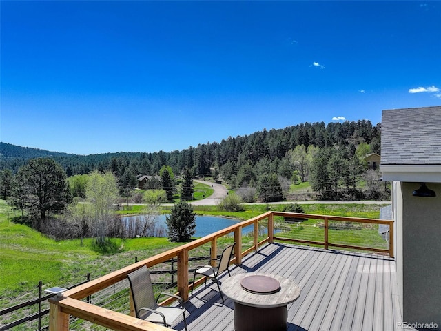 20101 Spring Gulch Rd, Morrison, CO 80465 - wooden deck featuring a forest view and a water view