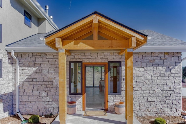 20101 Spring Gulch Rd, Morrison, CO 80465 - property entrance featuring a shingled roof and stone siding