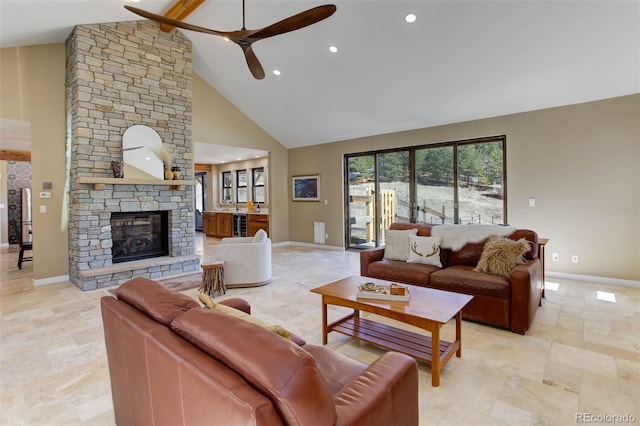 20101 Spring Gulch Rd, Morrison, CO 80465 - living area featuring high vaulted ceiling, baseboards, a ceiling fan, stone tile flooring, and beam ceiling