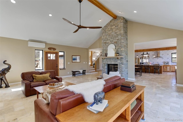 20101 Spring Gulch Rd, Morrison, CO 80465 - living area with a wall unit AC, a ceiling fan, beam ceiling, plenty of natural light, and high vaulted ceiling