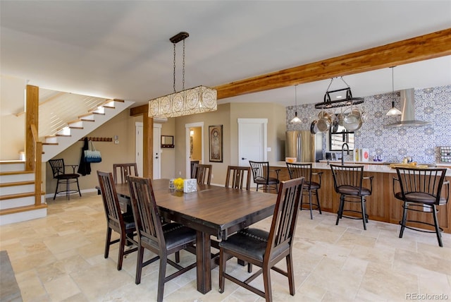 20101 Spring Gulch Rd, Morrison, CO 80465 - dining room with stairs, light stone finish flooring, and beamed ceiling