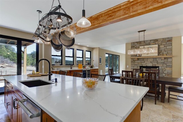 20101 Spring Gulch Rd, Morrison, CO 80465 - kitchen with a sink, a kitchen island with sink, healthy amount of natural light, and decorative light fixtures