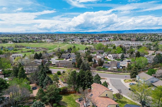 aerial view of residential area featuring a mountainous background