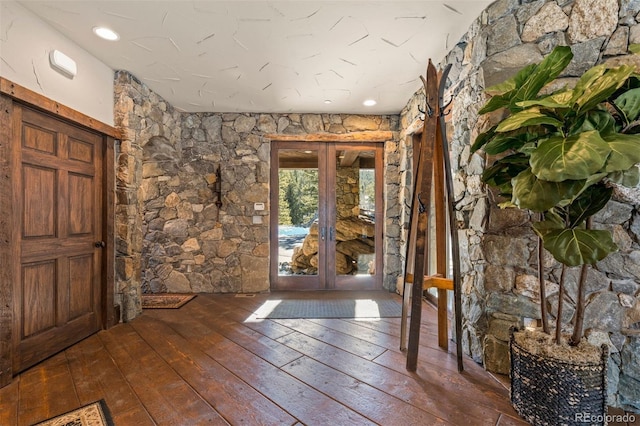 entrance foyer with dark wood-type flooring and french doors