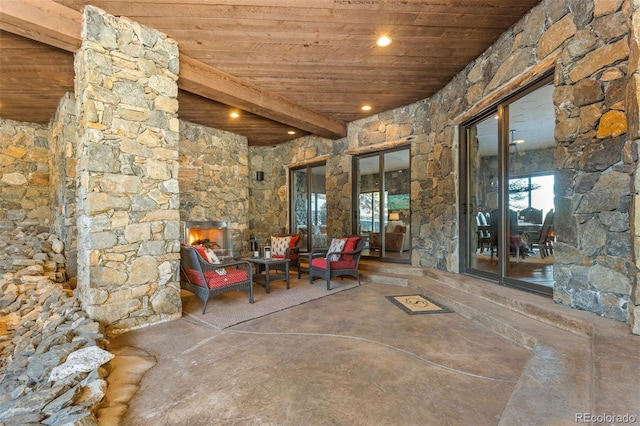 view of patio with a fireplace