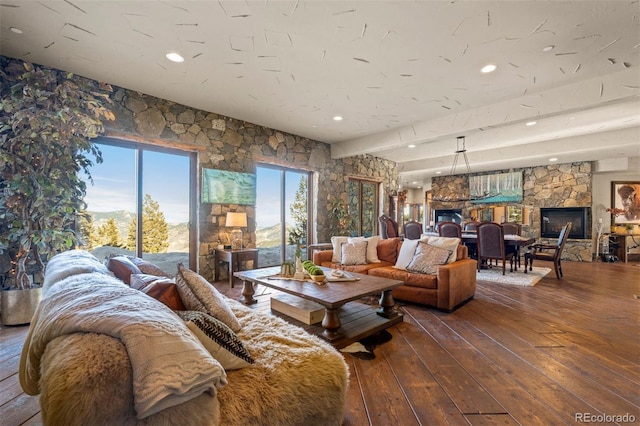 living room with wood-type flooring and a fireplace