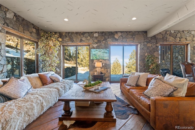 living room featuring hardwood / wood-style flooring and beamed ceiling