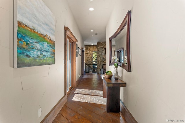 hallway with dark hardwood / wood-style floors