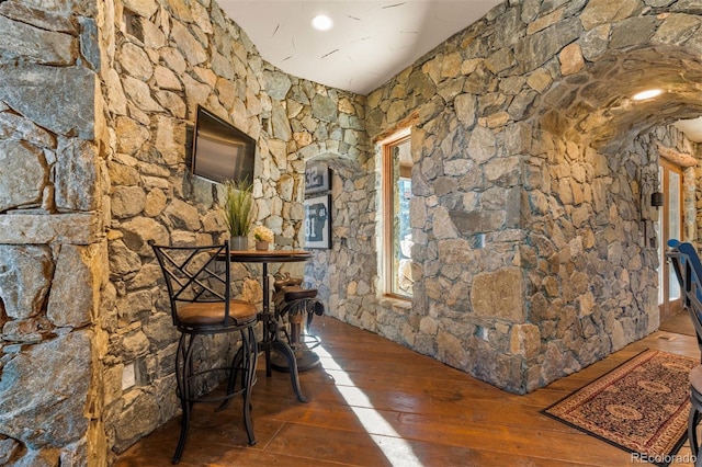 corridor featuring dark wood-type flooring