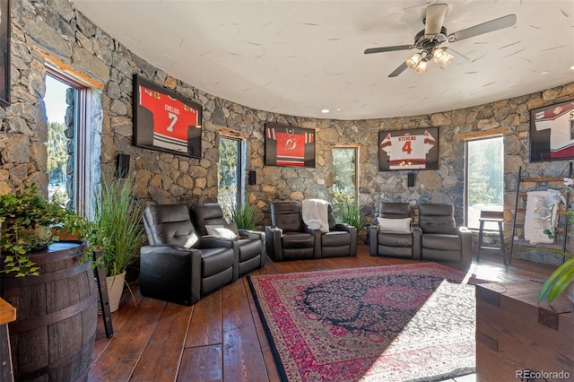 living room with hardwood / wood-style flooring and ceiling fan