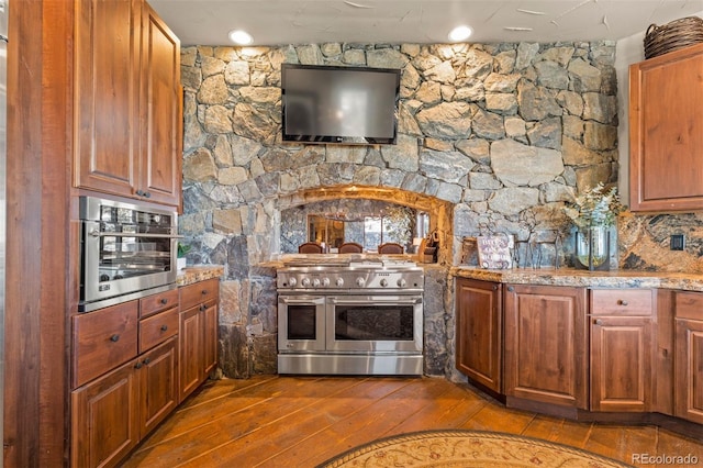 kitchen with stainless steel appliances and light hardwood / wood-style floors