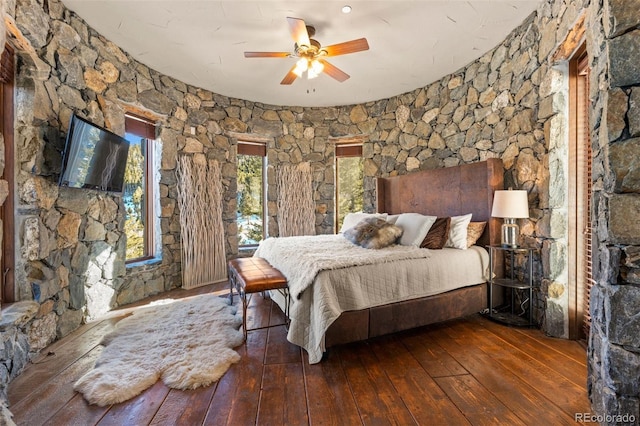 bedroom with dark wood-type flooring