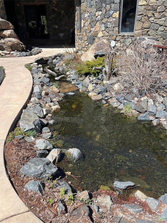 142 Outpost Ln, Evergreen, CO 80439 - exterior view of stone siding