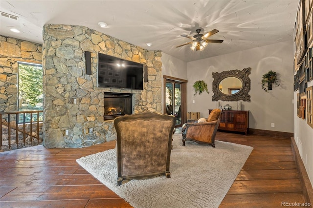 142 Outpost Ln, Evergreen, CO 80439 - living area with hardwood / wood-style floors, ceiling fan, a fireplace, and plenty of natural light