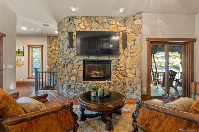 142 Outpost Ln, Evergreen, CO 80439 - living area with wood-type flooring, a fireplace, and lofted ceiling