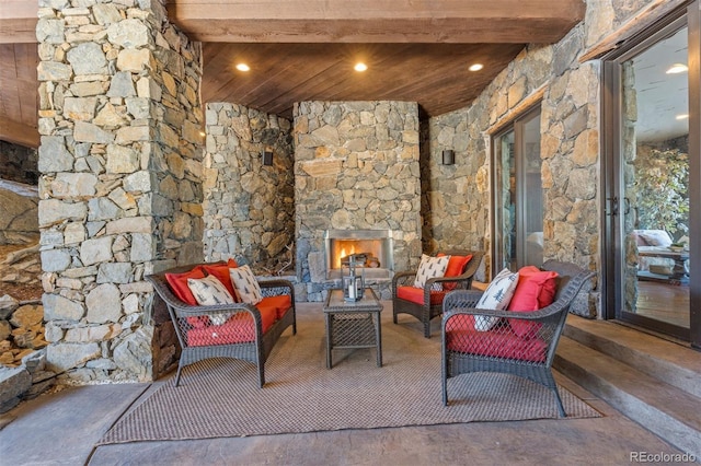 142 Outpost Ln, Evergreen, CO 80439 - view of patio / terrace with an outdoor living space with a fireplace