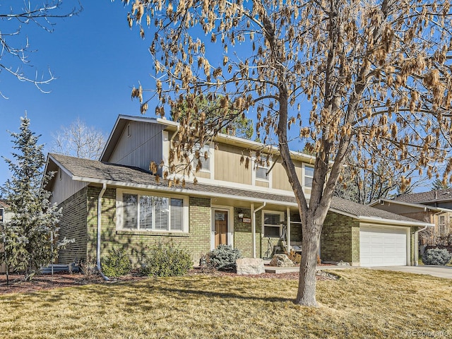 traditional-style house with a garage, brick siding, concrete driveway, and a front lawn