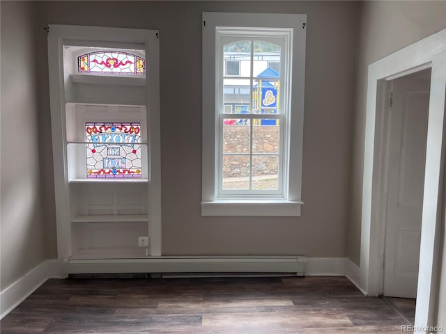 401 Rose St, Georgetown, CO 80444 - entryway with a baseboard heating unit and wood finished floors