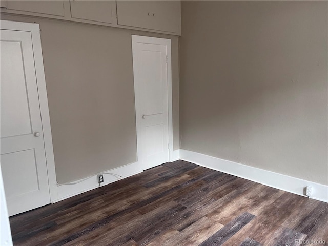 401 Rose St, Georgetown, CO 80444 - unfurnished bedroom with dark wood finished floors and baseboards