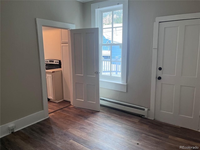401 Rose St, Georgetown, CO 80444 - entryway with baseboard heating and dark wood finished floors