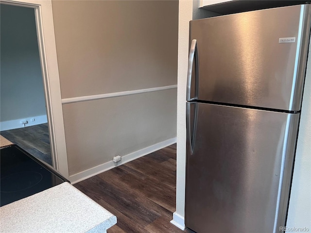 401 Rose St, Georgetown, CO 80444 - kitchen featuring freestanding refrigerator, black range with electric cooktop, and dark wood finished floors