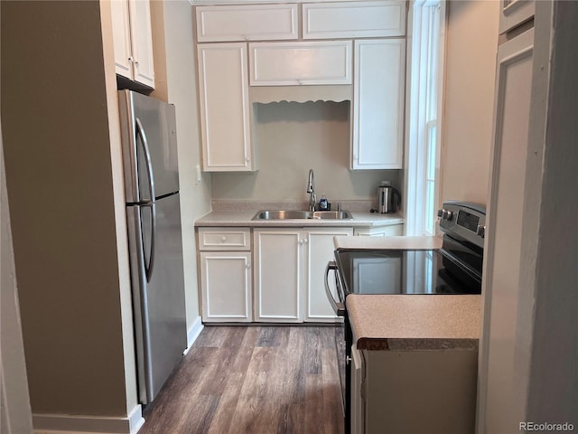 401 Rose St, Georgetown, CO 80444 - kitchen featuring appliances with stainless steel finishes, white cabinetry, wood finished floors, and light countertops