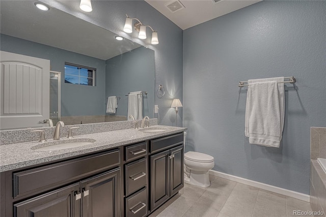 bathroom with a sink, tile patterned floors, toilet, and visible vents