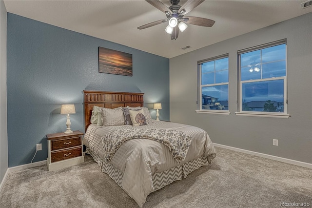 bedroom with carpet flooring, baseboards, and visible vents