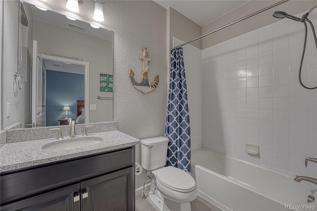 bathroom featuring vanity, visible vents, a textured wall, toilet, and shower / bath combo