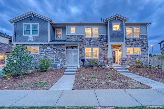 view of front of home with stone siding