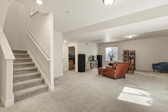 carpeted living room with stairway, visible vents, and baseboards