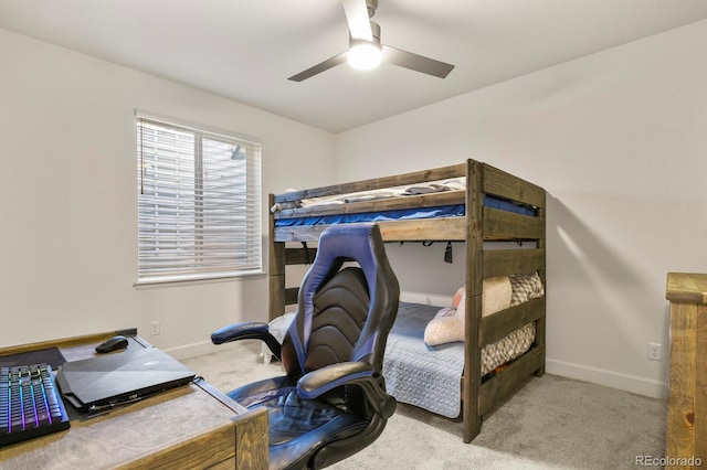 carpeted bedroom featuring baseboards and ceiling fan