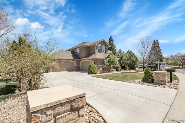 traditional-style house featuring a garage, stucco siding, a shingled roof, concrete driveway, and stone siding