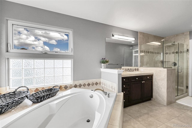 bathroom featuring a shower stall, tile patterned floors, vanity, and a bath