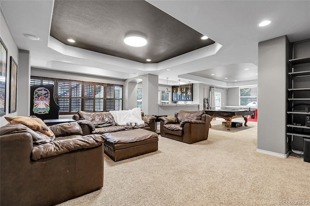 carpeted living area with a textured ceiling, recessed lighting, billiards, a tray ceiling, and baseboards
