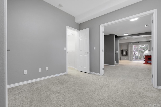 unfurnished bedroom with carpet flooring and baseboards