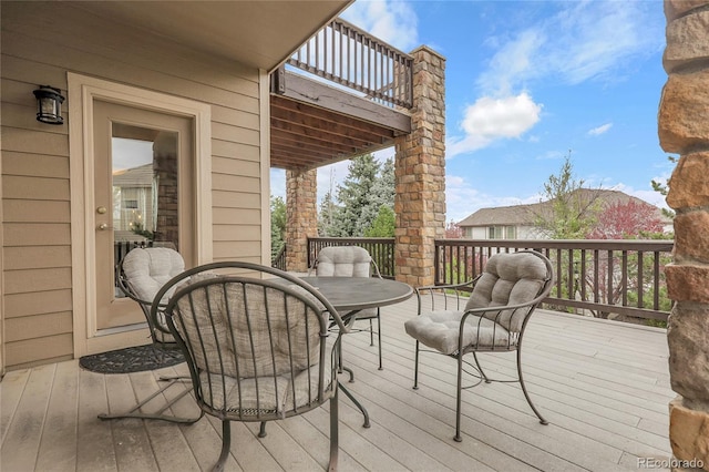 deck with outdoor dining space