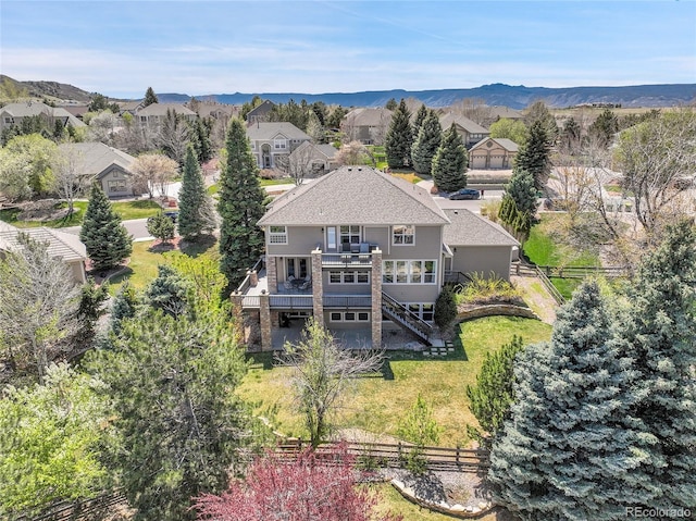 birds eye view of property with a mountain view and a residential view