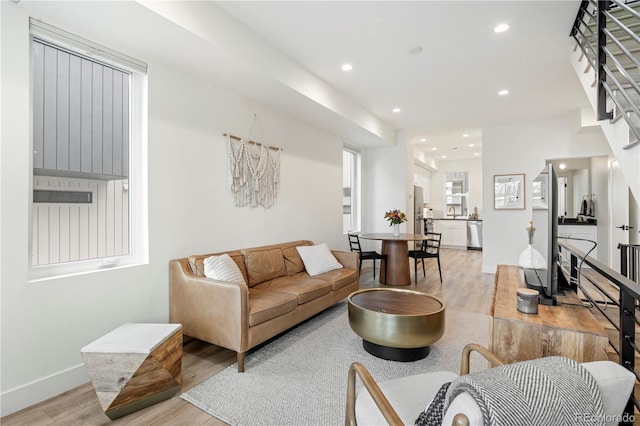 living room with light hardwood / wood-style flooring