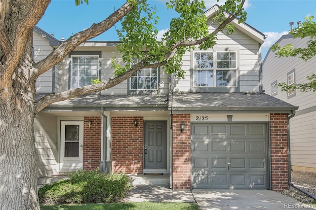 2125 E 103rd Ave, Thornton, CO 80229 - traditional-style home with brick siding, a garage, and driveway