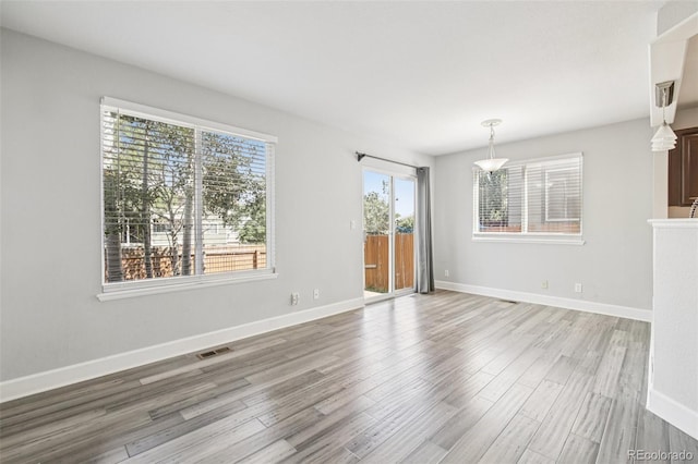 2125 E 103rd Ave, Thornton, CO 80229 - unfurnished living room featuring light wood-style floors