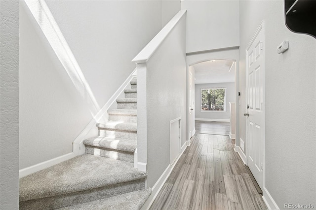 2125 E 103rd Ave, Thornton, CO 80229 - staircase with arched walkways and wood finished floors